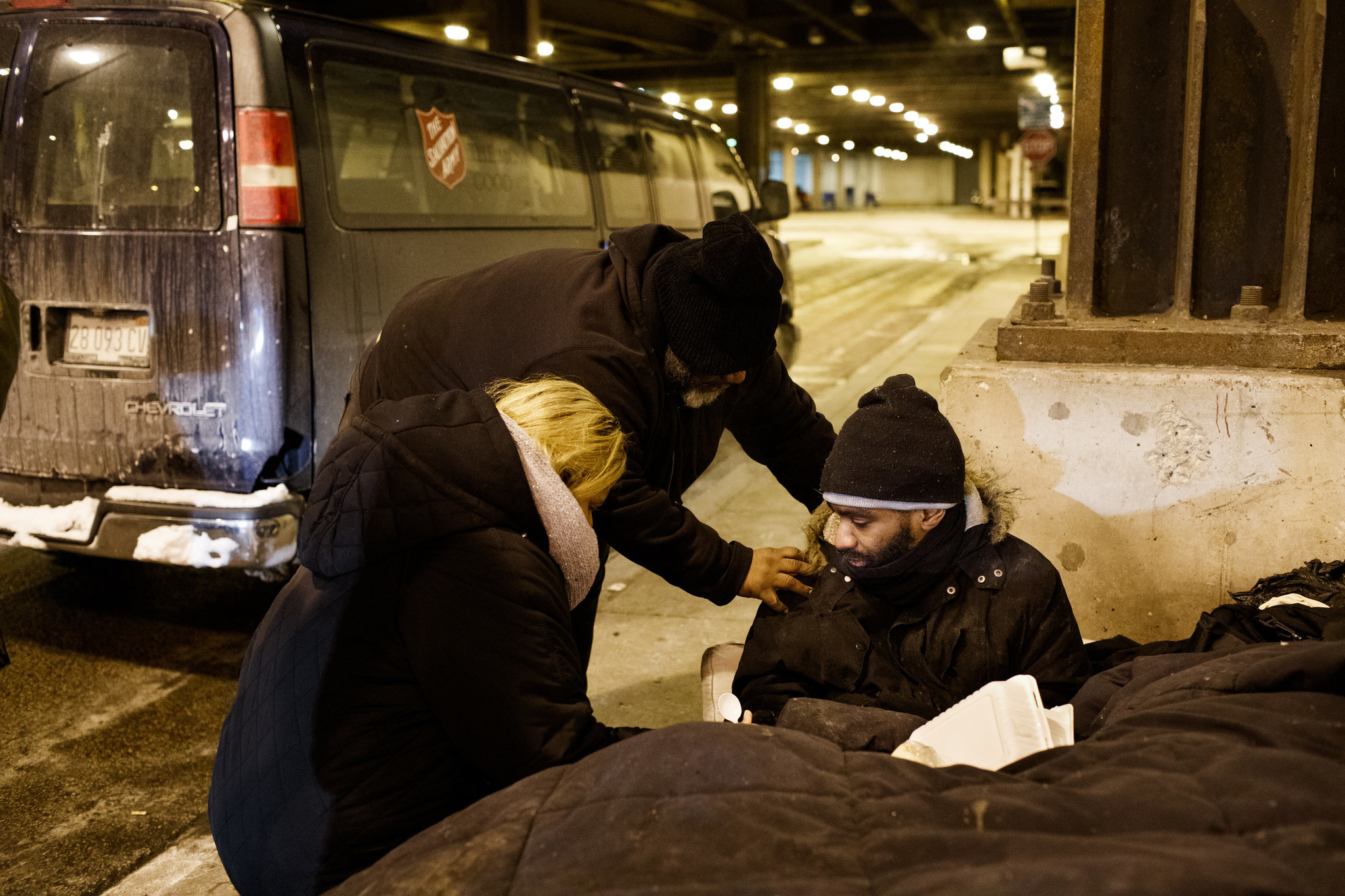 Richard Vargas of the Salvation Army and a woman from...