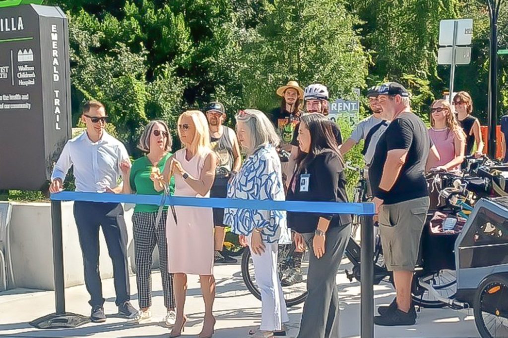 City and community stakeholders join Mayor Donna Deegan at the ribbon cutting marking the completion of the Park Street Road Diet.
