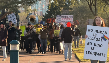 protesters holding anti-ice signs