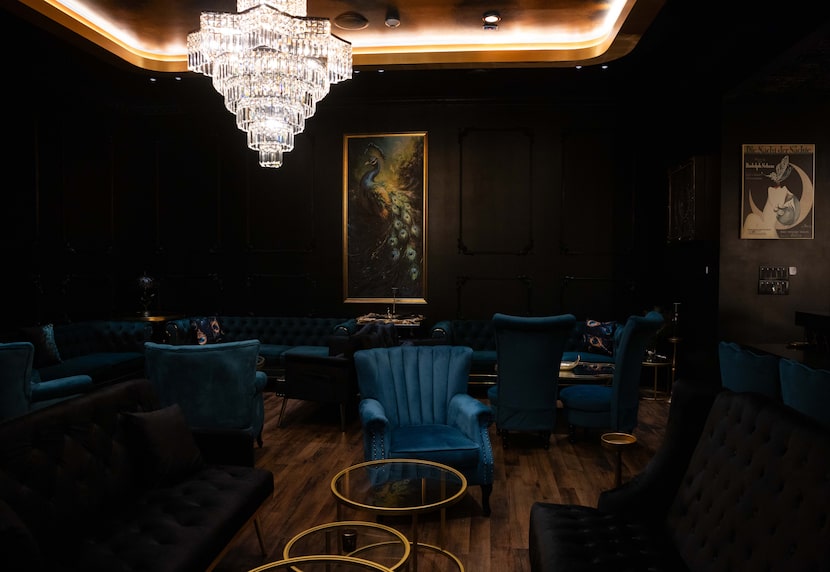 A hidden bar at The Gibson is located behind a wall of wine.