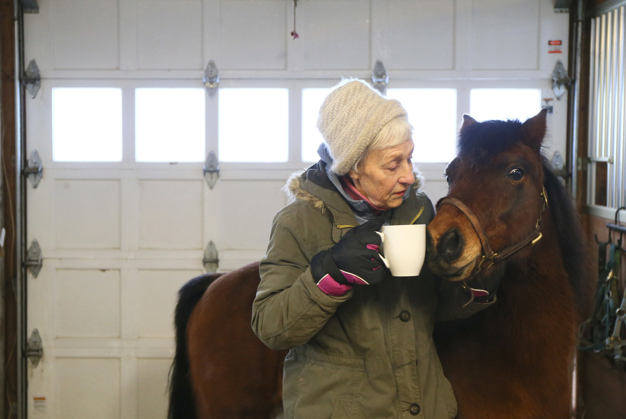 Cowboy nudges the coffee cup of Donna Ewing at the...