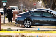 Grand Prairie police crime scene investigators work at a home in the 1600 block of Avenue B...