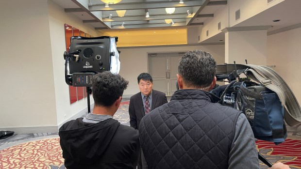 Filmmaker Charlie Minn, seen here in a shot being taken for his documentary on the unsolved Lane Bryant murder case in Tinley Park, said he hopes the movie will spark new interest and leads in the cold case. (Charlie Minn)