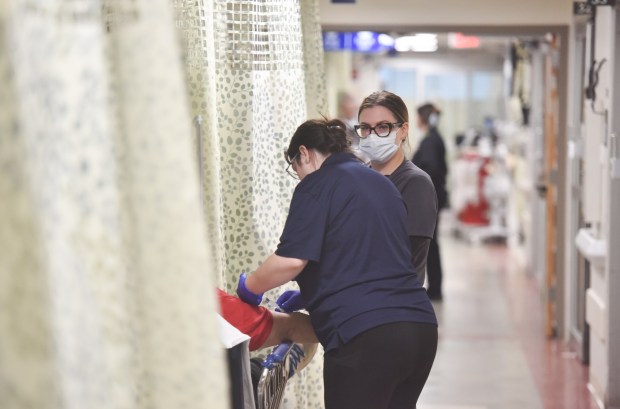 Registered nurse Donna Stobodzian and AEMT (Advanced Emergency Medical Technician) student Alyssa Quinn work in the emergency room at Geisinger Community Medical Center in Scranton Friday, January 16, 2026. (SEAN MCKEAG / STAFF PHOTOGRAPHER)
