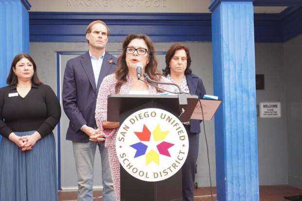 Fabiola Bagula, center, the superintendent of San Diego Unified School District, speaks about the arrest of a parent by Immigration and Customs Enforcement (ICE) near Linda Vista Elementary School at a press conference outside the school the following day, Friday, Aug. 15, 2025. (Michael Ho / The San Diego Union-Tribune)