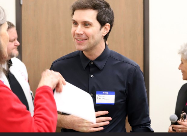 Riverside, Ca., December 20, 2025. CA-48 candidate Marc Iannarino talks with a guest during the congressional candidates for the CA-48 open forum with community members at the I.B.E.W.L.U. #47. (James Carbone/For The San Diego Union-Tribune)