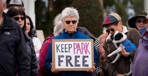 SAN DIEGO, CA - JANUARY 24: Sara Rosenthal, who lives near Balboa Park, attended the rally at the Organ Pavilion in Balboa Park, protesting the newly implemented parking fees at the park, Saturday January 24, 2026, in San Diego, California. (Howard Lipin / For The San Diego Union-Tribune)
