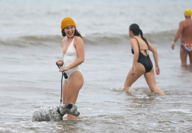 Ariana Kier walks in the ocean at La Jolla Shores beach after participating in the New Year's Day Polar Bear Plunge on Jan. 1, 2026 in San Diego. (K.C. Alfred / The San Diego Union-Tribune)