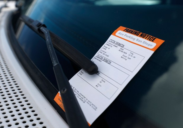 A warning ticket was placed on a vehicle at the San Diego Zoo the day paid parking was implemented throughout Balboa Park on Monday, Jan. 5, 2026. (K.C. Alfred / The San Diego Union-Tribune)