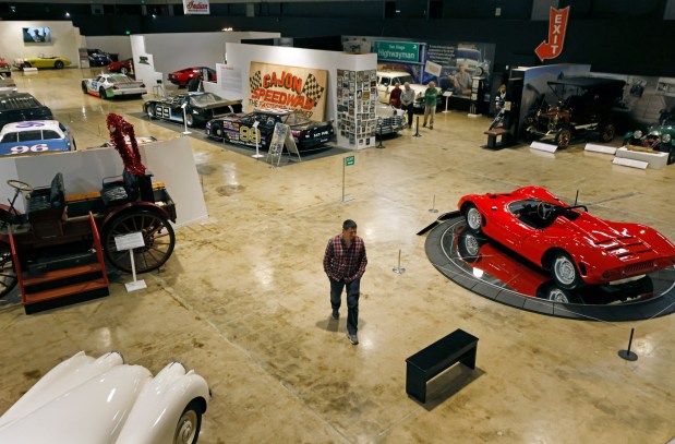 San Diego, CA - January 21: Visitor Seth Green walks through a nearly empty San Diego Automotive Museum in Ballboa Park on January 21, 2026 in San Diego, CA. The city recently implemented paid parking in the park and museums have a seen a decline in visitors. (K.C. Alfred / The San Diego Union-Tribune)