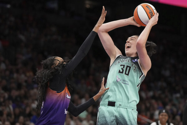 New York Liberty forward Breanna Stewart (30) looks to shoot over Phoenix Mercury forward DeWanna Bonner, left, during the second half of Game 3 in the first round of the WNBA basketball playoffs, Friday, Sept. 19, 2025, in Phoenix. (AP Photo/Rick Scuteri)