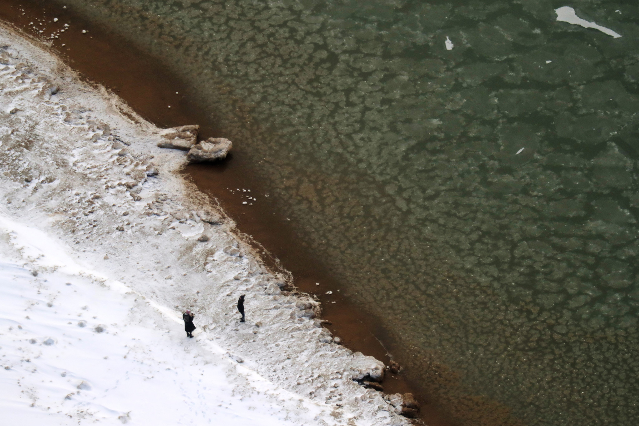 A woman poses for a photograph at Oak Street Beach...