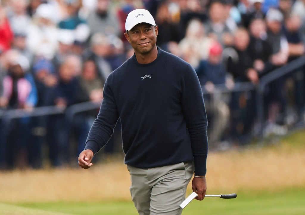 Tiger Woods looks on during the 2024 British Open at Royal Troon, an event in which he missed the cut.