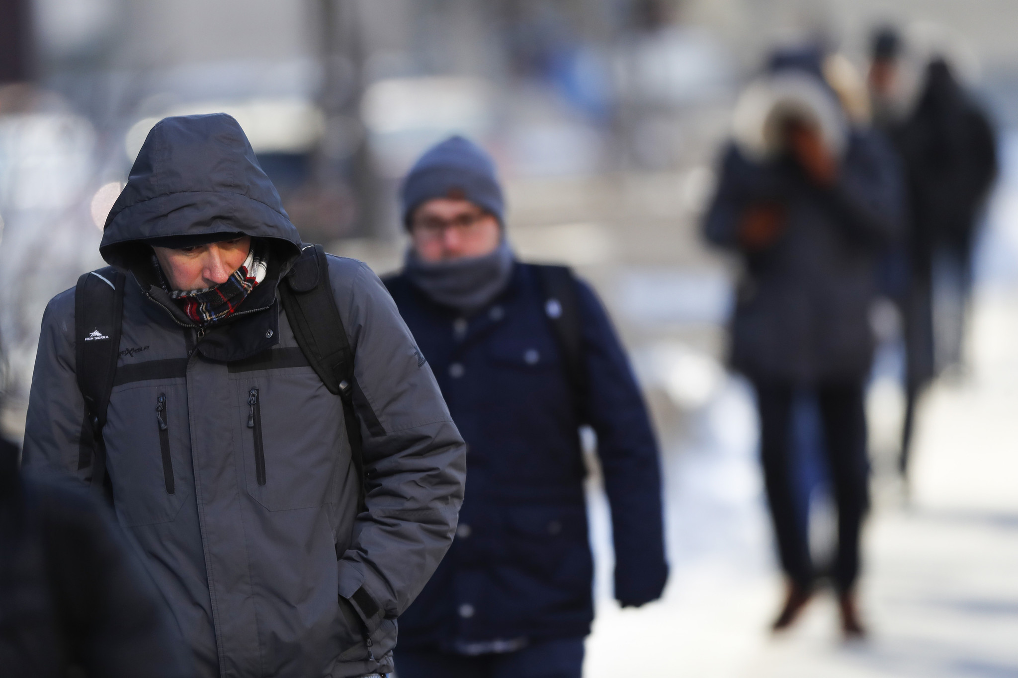 Pedestrians walk on West Wacker Drive in Chicago on a...