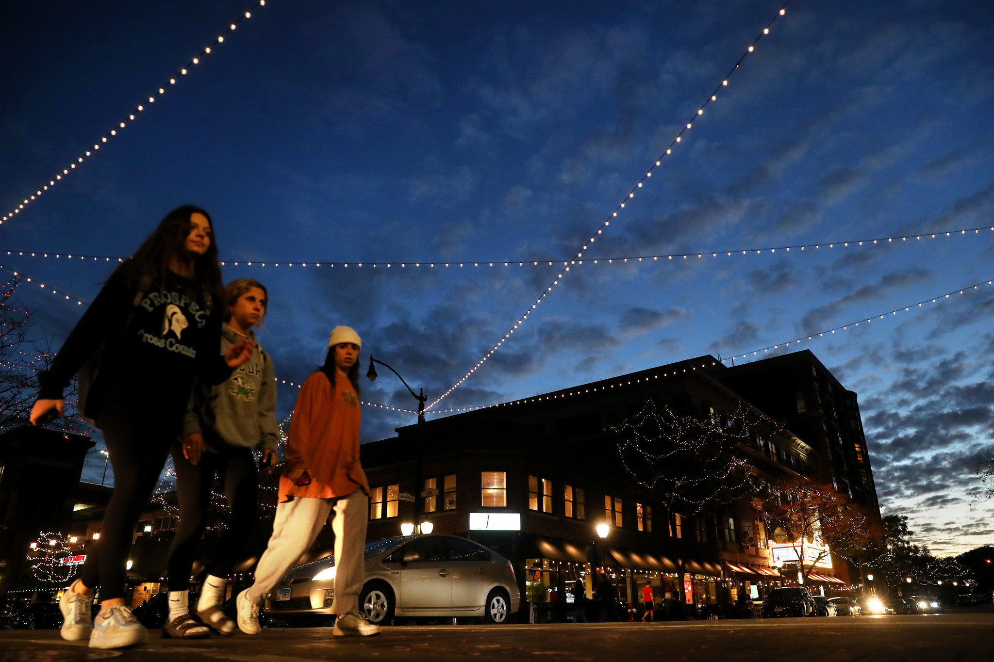People walk through the intersection of Vail Avenue and Campbell...