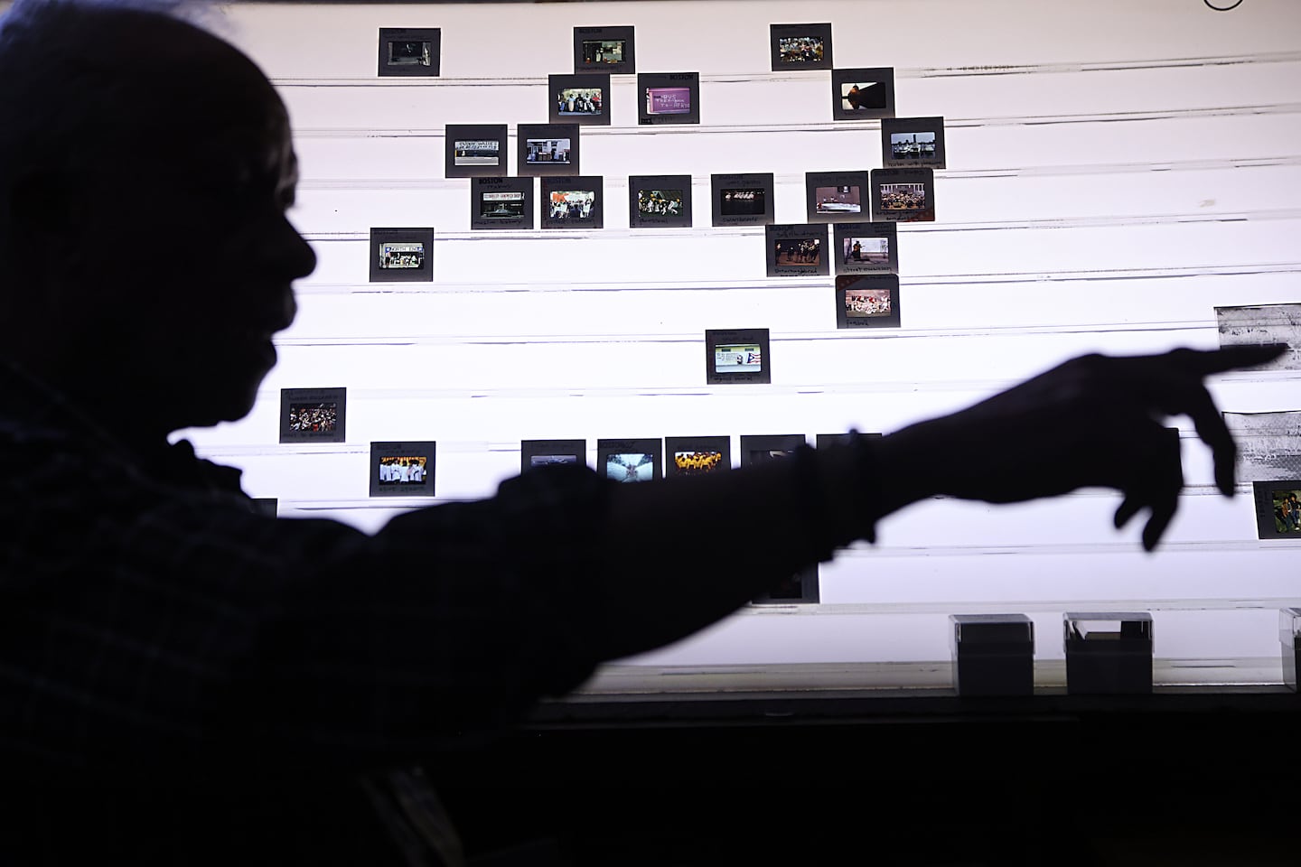 Jones spoke about his photography in front of of his slides placed on a light box. 