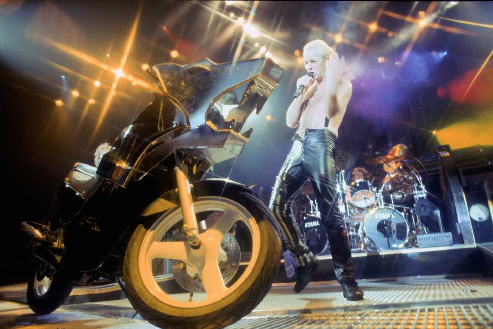 Rob Halford and a motorbike during a Judas Priest show