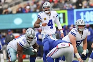 Dallas Cowboys quarterback Dak Prescott (4) speaks to his teammates before the play during...
