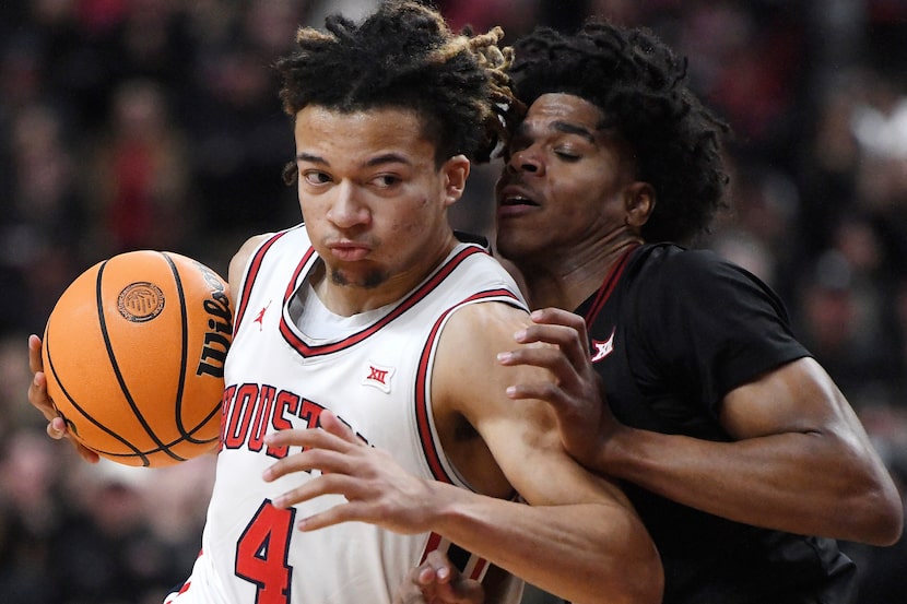 Houston guard Kingston Flemings (4) collides with Texas Tech guard Christian Anderson (4)...