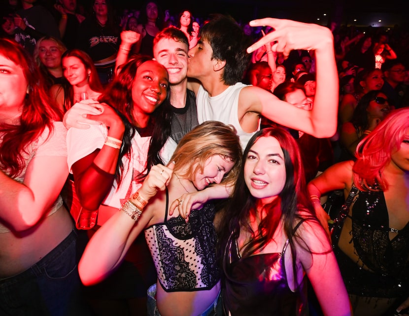 Attendees dance at one of Club 90s' "Heated Rivalry"-themed events in Santa Ana, California.