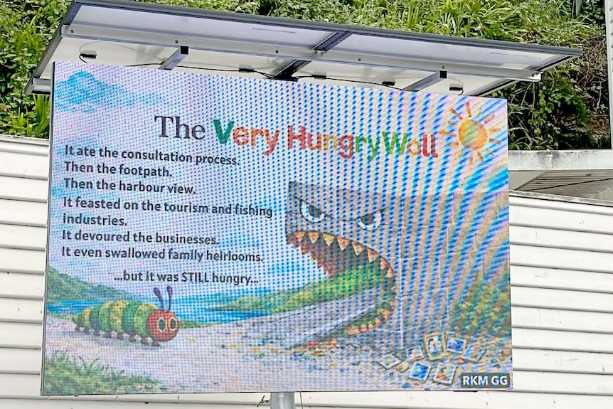 An electronic billboard about 'The Very Hungry Wall'.