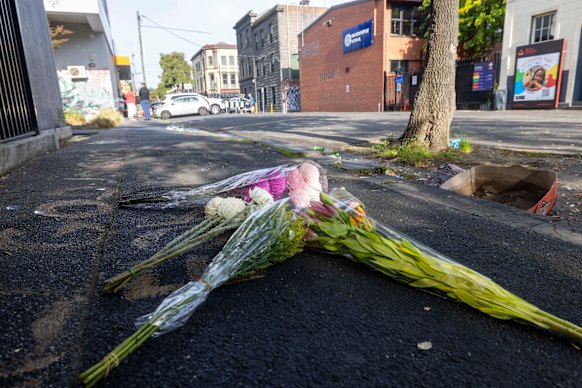 Flowers left on Saturday morning at the scene of the shooting in Fitzroy.
