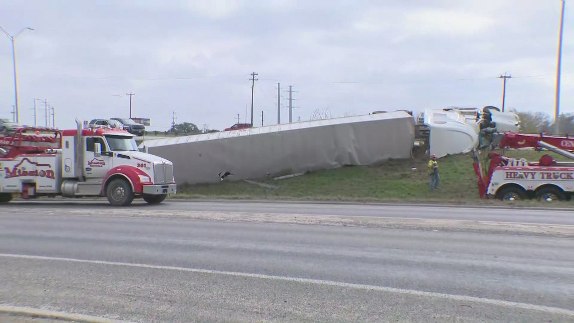 SAPD: 18-wheeler driver loses control, flips over on Loop 410