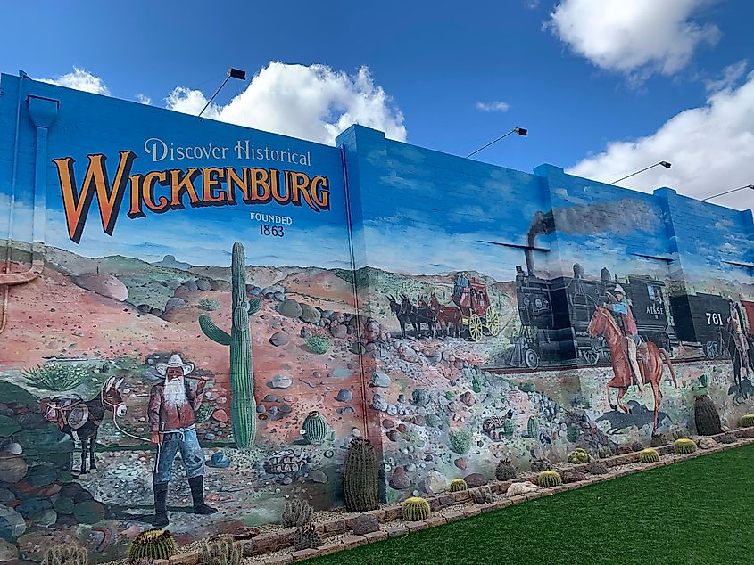 Murals in the streets of Wickenburg depicting historical scenes.