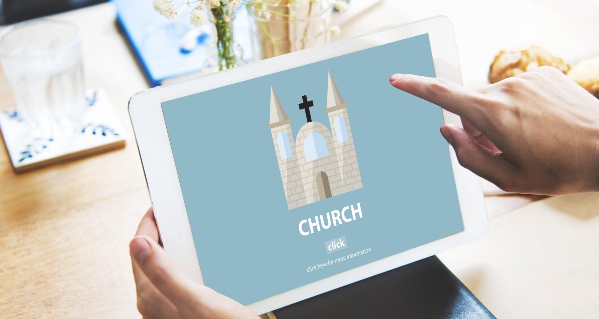 Illustration of a church displayed on a tablet