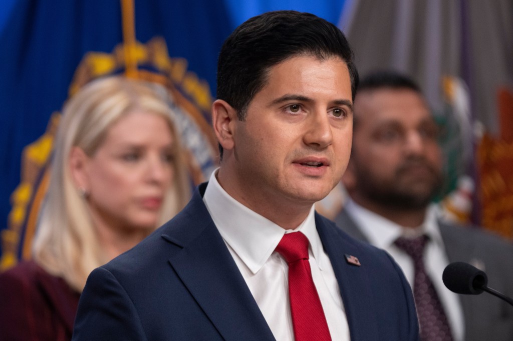 Bill Essayli speaking at a news conference.