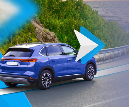 Blue SUV driving on a coastal road with a large Android Auto logo overlayed on the image.