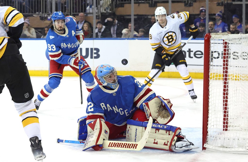 New York Rangers goaltender Jonathan Quick #32 watches as the puck hits off the goal post during the second period.
