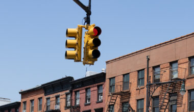 red light on atlantic avenue with buildings in the background