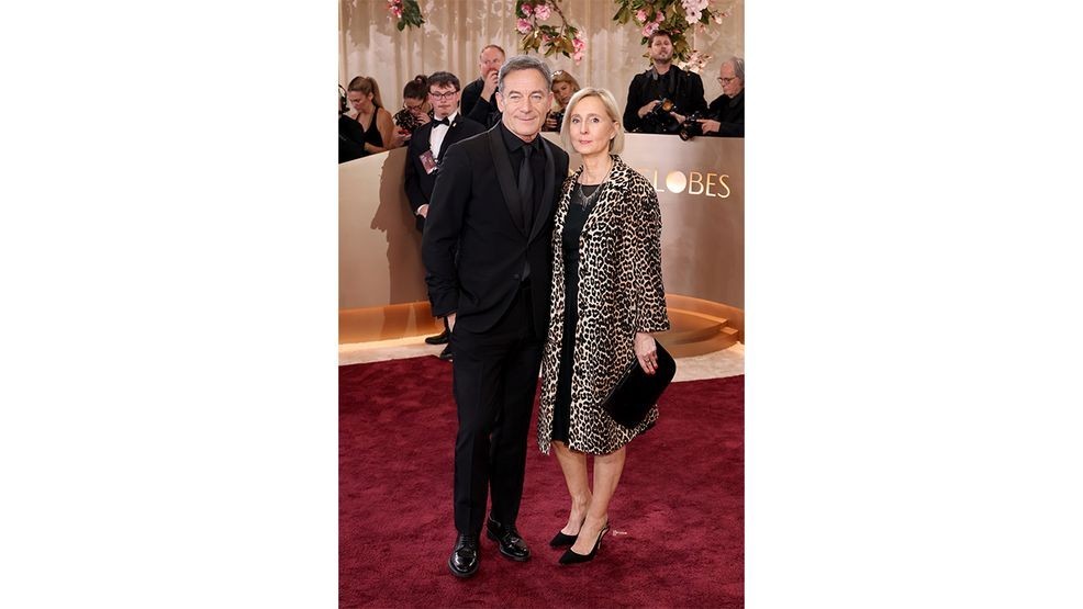 BEVERLY HILLS, CALIFORNIA - JANUARY 11: (FOR EDITORIAL USE ONLY) (L-R) Jason Isaacs and Emma Hewitt attends the 83rd Annual Golden Globe Awards at The Beverly Hilton on January 11, 2026 in Beverly Hills, California. (Photo by Monica Schipper/Getty Images)