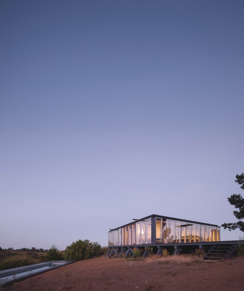 Chilean prefabricated timber home at night