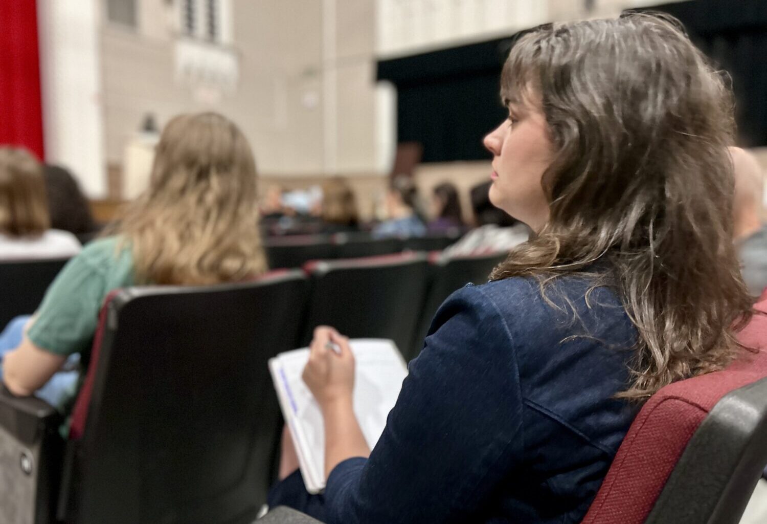 Houston ISD Magnet Info Session Parent Taking Notes