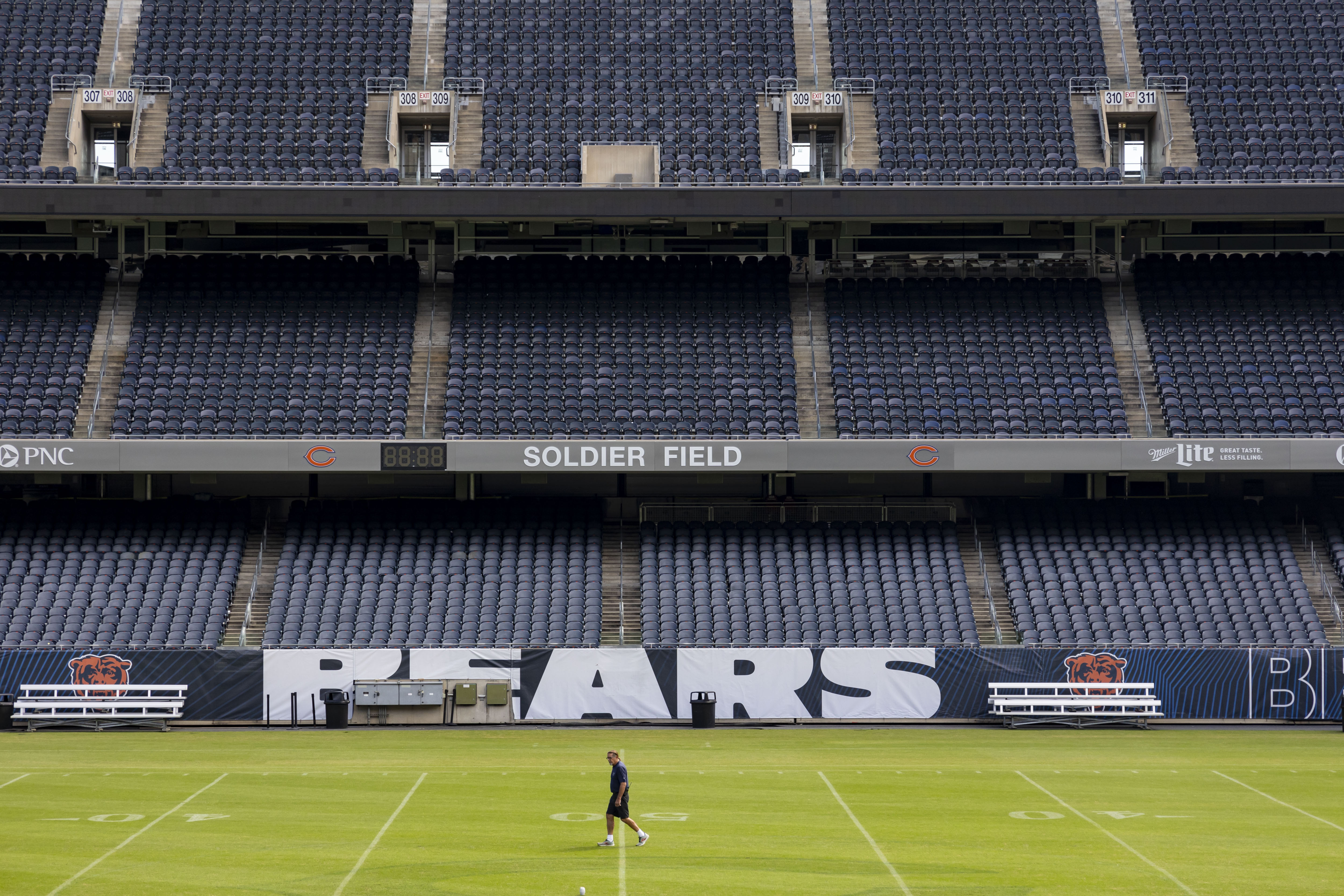 The grounds crew prepares the grass Sept. 5, 2023, at...