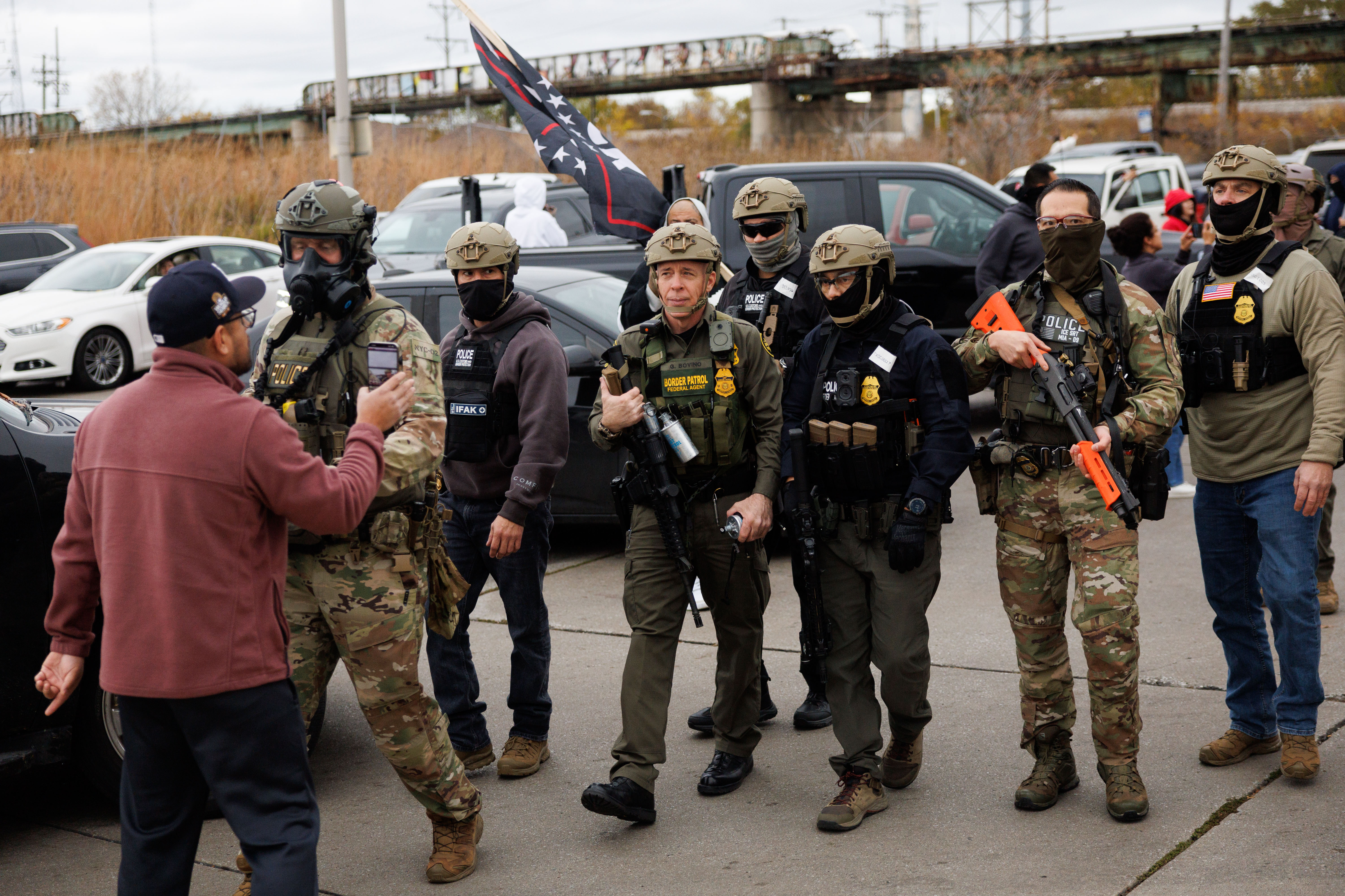 A man yells at Border Patrol Cmdr. Gregory Bovino near...