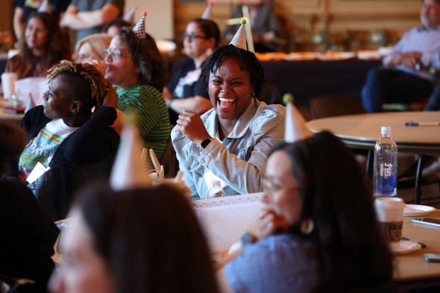 Jonnisha Moore, center, of Walt Disney Fine and Performing ARTS Magnet School, laughs as Natalie Merchant leads a workshop for Chicago Public Schools early educators at Symphony Center, Oct. 8, 2025. (Terrence Antonio James/Chicago Tribune)