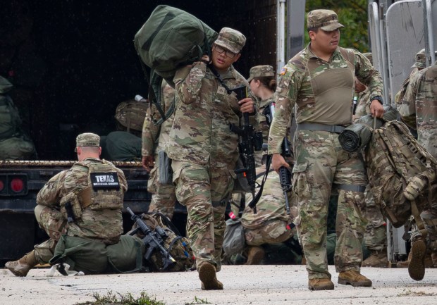 Members of the Texas National Guard arrive Oct. 7, 2025, at the Army Reserve Training Center in Elwood. (Brian Cassella/Chicago Tribune)