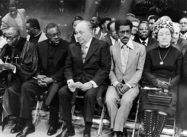 Among those attending funeral services at Arie Crown Theater for Mahalia Jackson are Rev. Leon Jenkins, from left, the pastor of Greater Salem Baptist Church; Joseph Jackson, who gave a eulogy; Mayor Richard J. Daley, entertainer Sammy Davis Jr. and Eleanor "Sis" Daley on Feb. 1, 1972. Editors note: this historic print shows some hand painting in the background. (Walter Kale/Chicago Tribune) 