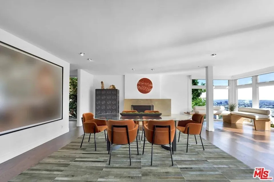 The two-bedroom, 2.5 bath home bares ample white wall expanses, where posh pieces have been prominently displayed through the years.