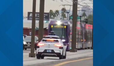 Waymo car seen driving on light rail tracks in Phoenix