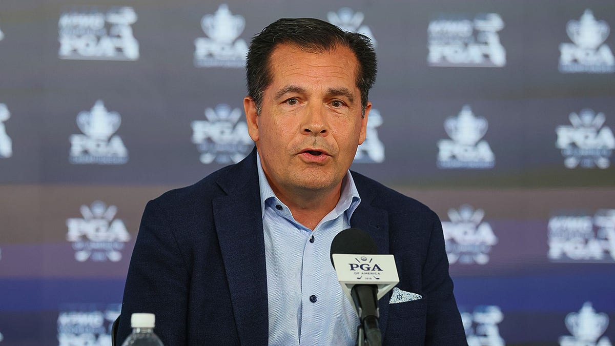 Derek Sprague speaks with reporters