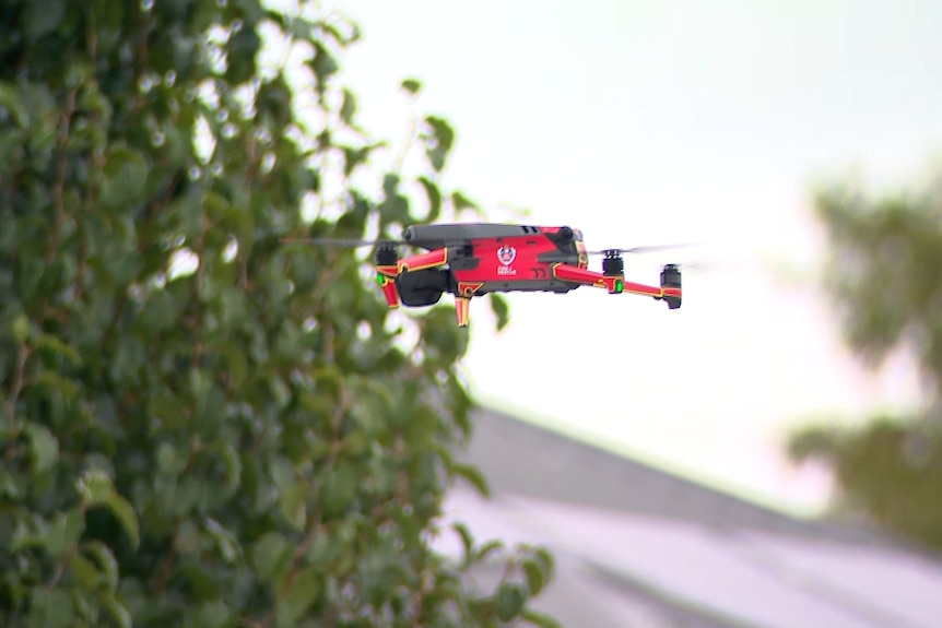 a drone flies over the scene of a fire in spring farm