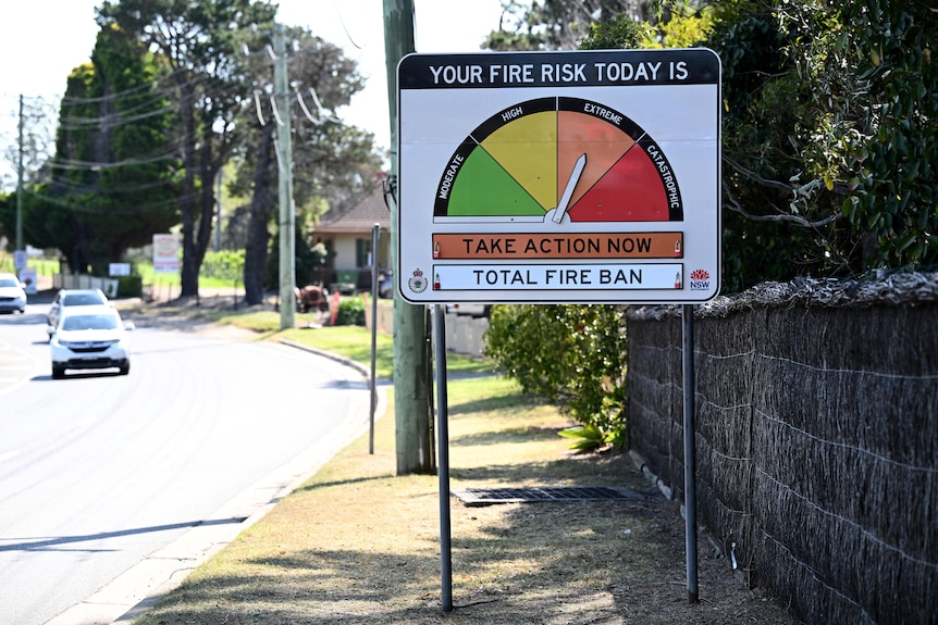 A bushfire danger advisory sign shows extreme fire risk and a total fire ban