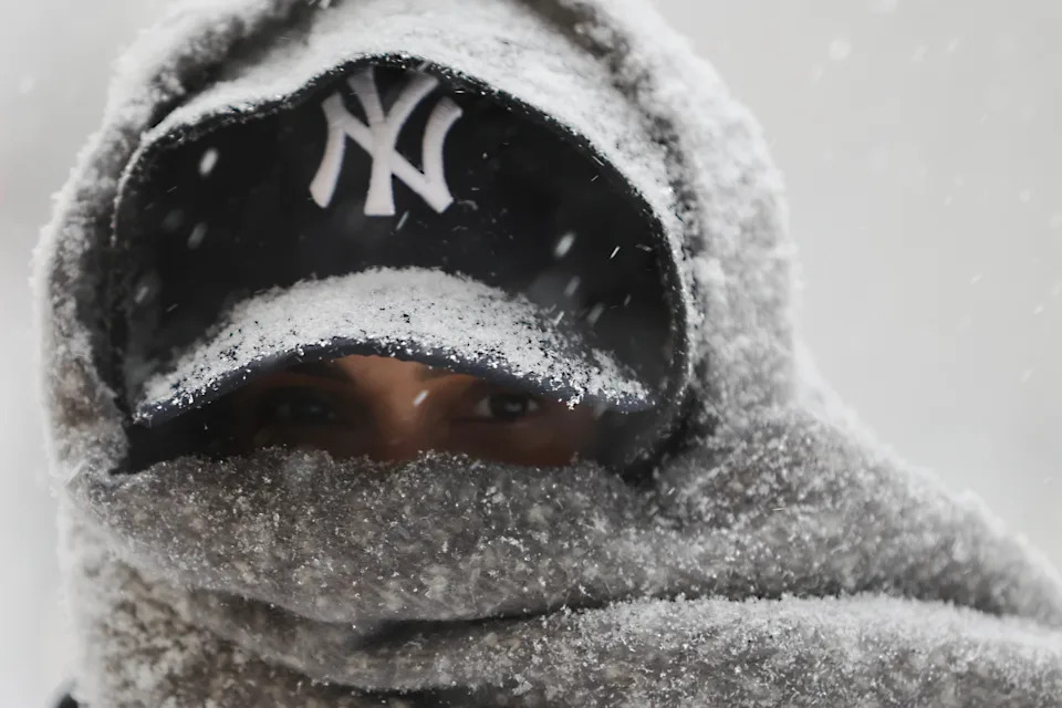 Abrar Omar walks through Manhattan during a winter storm on Jan. 25, 2026, in New York.