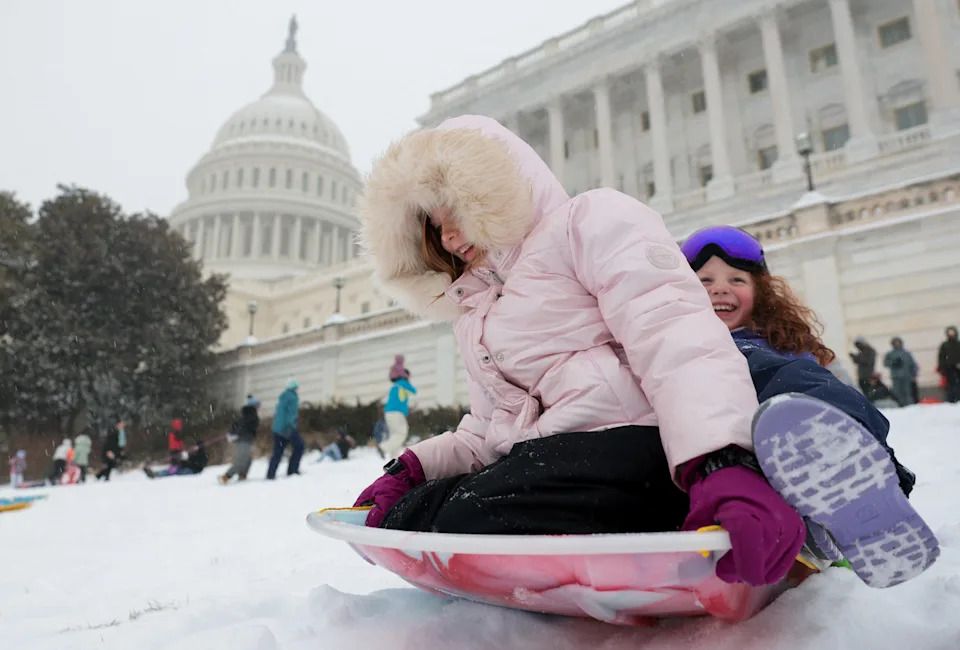 Children sled near the U.S. Capitol building in Washington, D.C.,on Jan. 25, 2026.