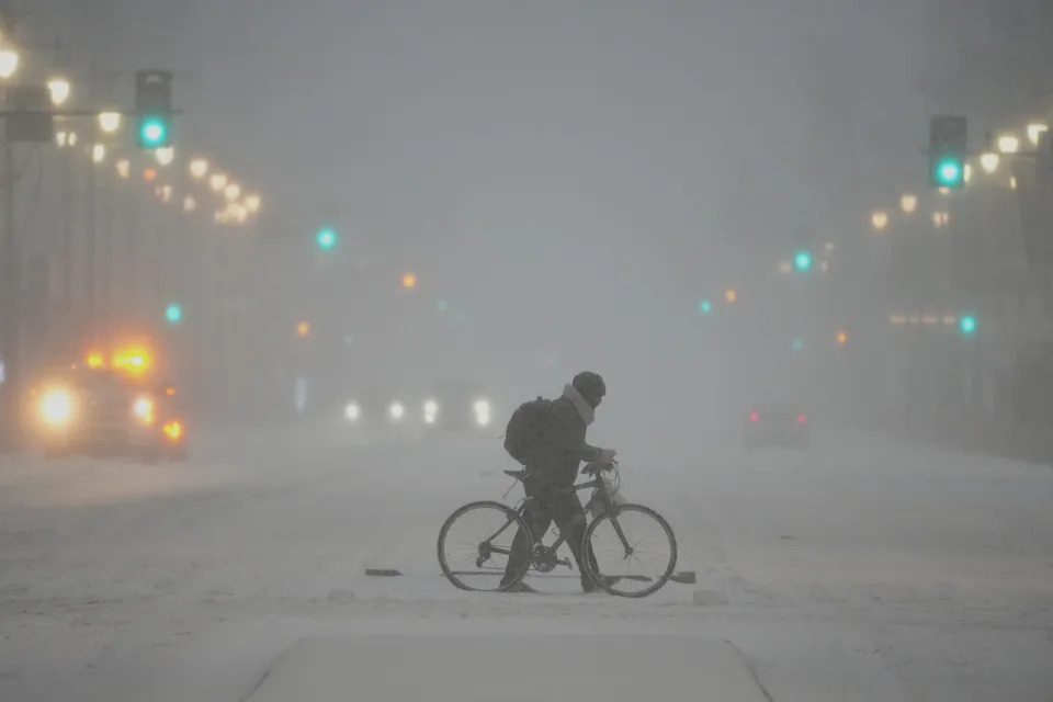 A person pushed a bicycle during a winter storm in Philadelphia, on Jan. 25, 2026.