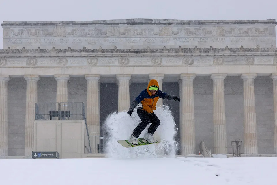 Jonnie Plass snowboards on the stairs near the Lincoln Memorial on January 25, 2026 in Washington, DC.